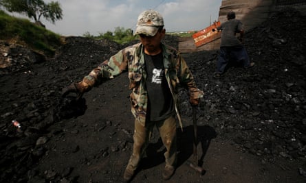 Coal miners work at an artisanal mine in Nueva Rosita on 31 July 2008.