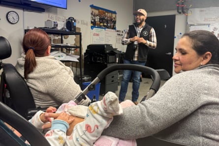 a woman looks at her baby in a room
