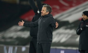 The Southampton assistant manager, Richard Kitzbichler, on the touchline with his arms raised to his side