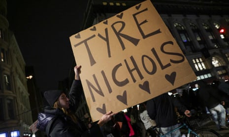 A person holds a sign with Tyre Nichols’s name at a protest in New York City on 28 January. 