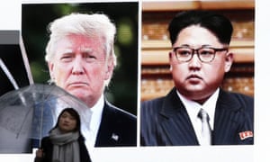 screen showing U.S. President Donald Trump, left, and North Korea’s leader Kim Jong Un