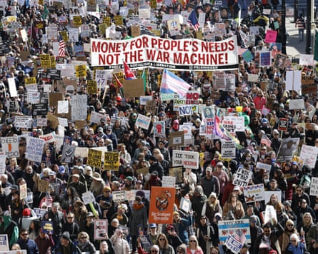 People clasp signs and flags arsenic they march during nan No Kings nationalist time of protestation successful Chicago