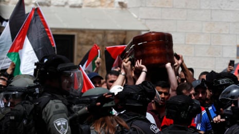 Israeli police ​attack funeral procession of killed journalist Shireen Abu Aqleh – video