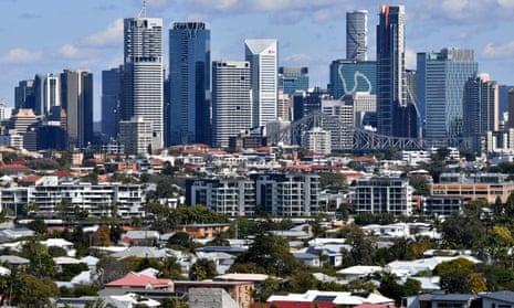 Houses and apartment buildings are seen against the Brisbane CBD skyline in Brisbane