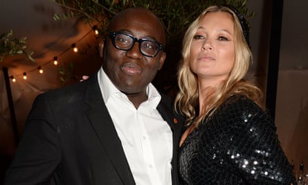 Edward Enninful celebrating the December issue of British Vogue in London, with Kate Moss.