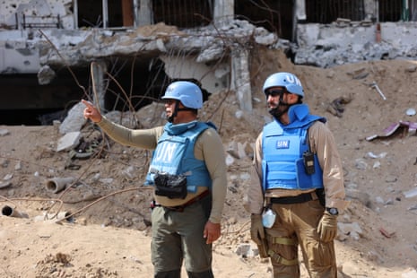 A United Nations team inspects the grounds of Al-Shifa hospital which was reduced to ruins by a two-week Israeli raid, on Monday.