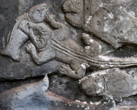 Close up of a stone relief carving of a crocodile