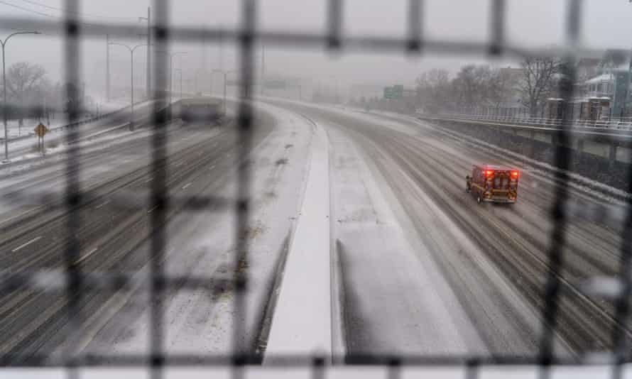 A lone ambulance travels on an empty Interstate 195 in Providence, Rhode Island.