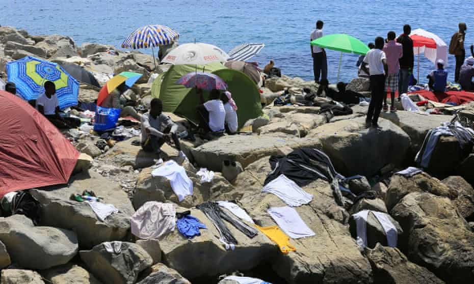 Migrants living on the Italian coast near the French border