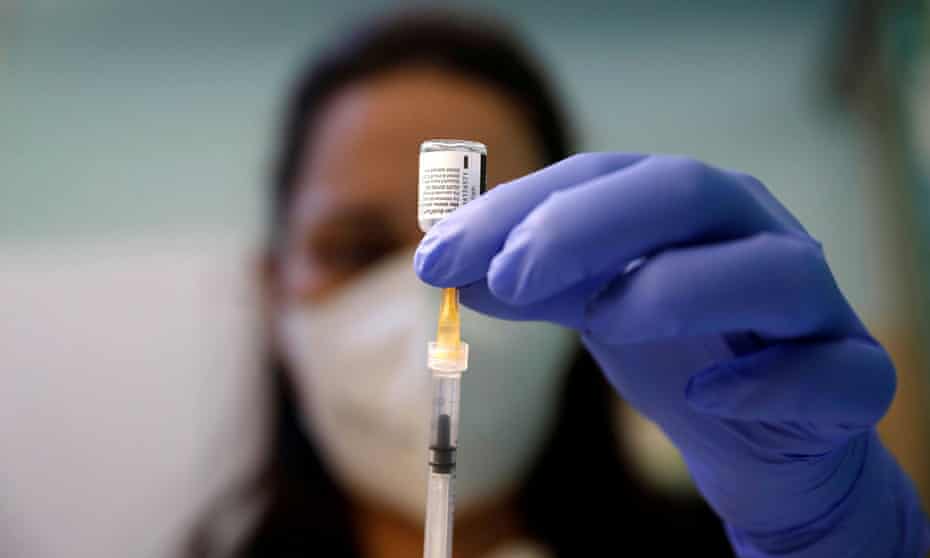 A healthcare worker in Rome prepares a dose of the coronavirus vaccine.