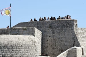 Visitors take pictures from the city wall