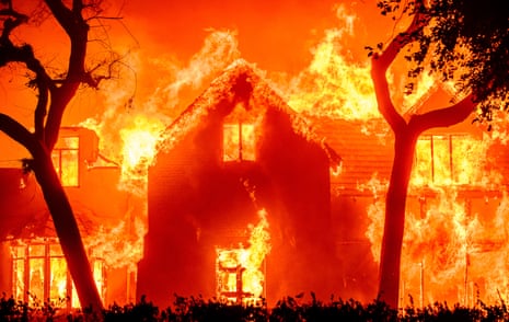 A home is engulfed in flames during the Eaton fire.