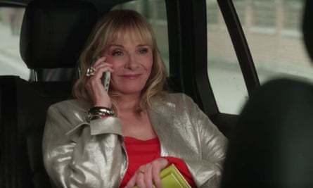 Kim Cattrall as Samantha in a car on the phone