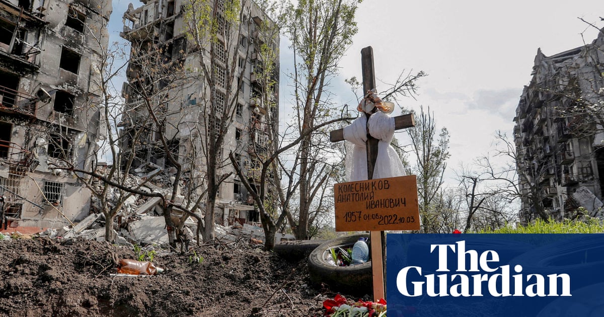 Makeshift graves and notes on doors: the struggle to find and bury Mariupol’s dead