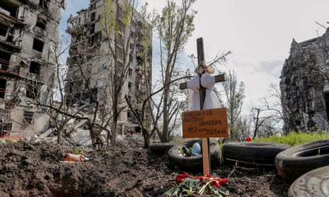 A makeshift grave in a courtyard in Mariupol.