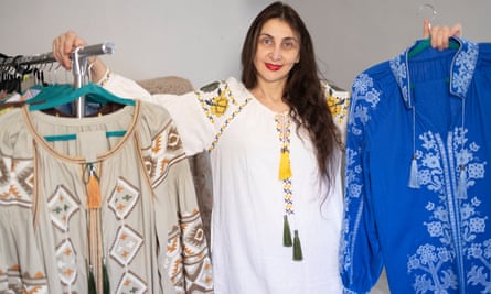 Nataliia Horbenko with her clothes featuring Ukrainian motifs