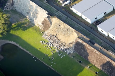 Pile of rubble at the bottom of what looks like a collapsed old stone wall