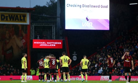 Players wait as VAR takes five minutes to make a call on a disallowed Jay Rodriguez goal for Burnley.