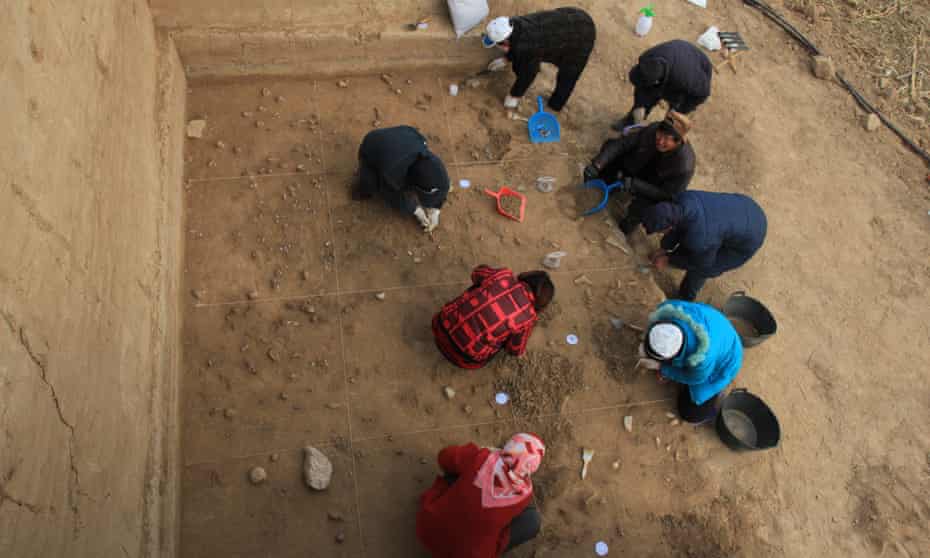 Archeologists at the 40,000-year-old ochre processing site in northern China.