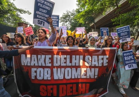 Protesters hold a placard saying: 'Make Delhi safe for women'