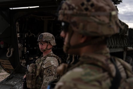 A US soldier monitors the area while standing next to a Stryker combat vehicle in Sunland Park, New Mexico, on 23 July 2025.