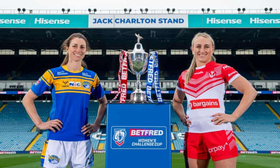 Courtney Winfield-Hill with her opposite number, St Helens’ Jodie Cunningham, and the Betfred Women’s Challenge Cup.
