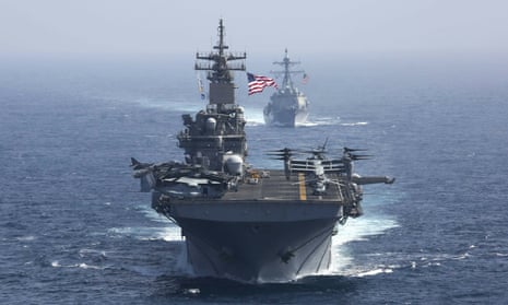 The USS Kearsarge and USS Bainbridge sail as part of the USS Abraham Lincoln aircraft carrier strike group, which was sent to the Gulf. 