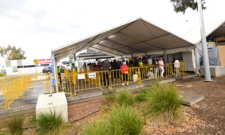 People queue at the Goulburn Valley Health-Mcintosh Covid testing facility in Shepparton