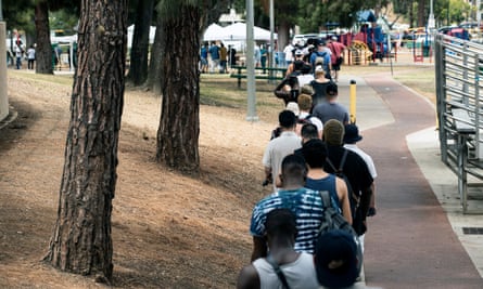 More than a hundred people wait in line to get a monkeypox vaccine in Los Angeles.