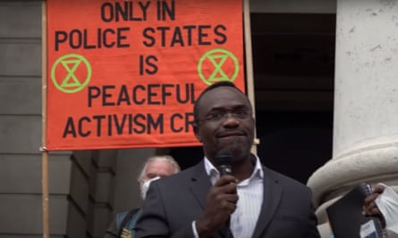 Chidi Oti-Obihara speaking at a protest in the City of London last week.