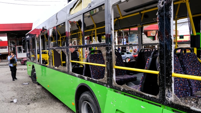 A heavily damaged public bus is seen after Russian forces targeted Kharkiv.