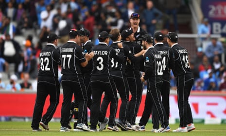 The New Zealand side celebrate as MS Dhoni of India is run out by Martin Guptill.