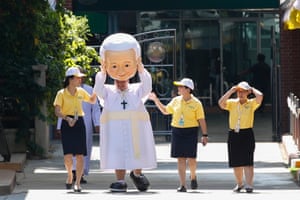 A man in a Pope Francis costume in Bangkok, Thailand