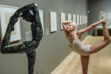 ‘Superb, sensual poses’... Noora Kela strikes a pose alongside a Rodin statue.