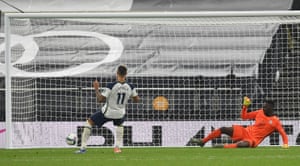 Tottenham Hotspur’s Erik Lamela slots the ball home during the penalty shootout .
