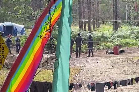 Police arrive at the Colo valley camp on Sunday, 19 June.