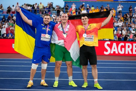 Bronze medalist Ukraine's Mykhaylo Kokhan (left), gold medalist Hungary's Bence Halasz (centre) and silver medalist Germany's Merlin Hummel pose after the men's hammer throw final.