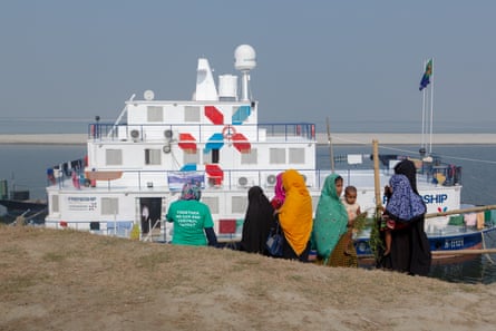 The charity Friendship’s floating hospital vessel delivering cervical cancer testing kits to a remote part of Bangladesh.