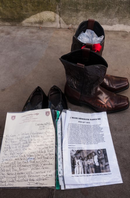 Cowboy boots and a pair of shoes next to a file on the Miami Showband