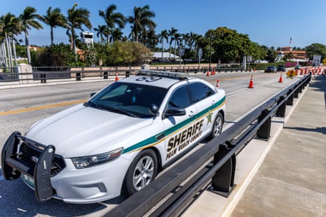 A Palm Beach County Sheriff Office vehicle patrols a road block near the Mar-a-Lago club in West Palm Beach, Florida, on 22 February 2026.