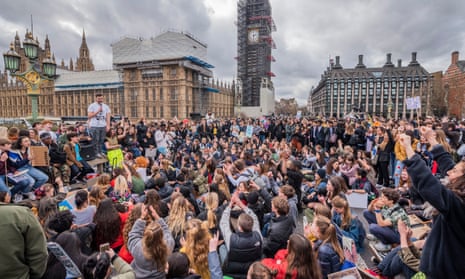 Young supporters of Extinction Rebellion block Westminster Bridge in London, 15 March 2019