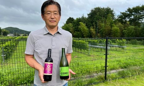 Hisanao Okawara shows off his winery’s wares.