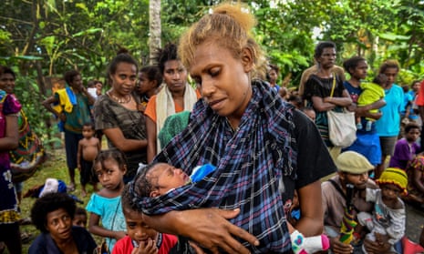 A mother and baby at a polio vaccination clinic in Lae, Marobe province, Papua New Guinea.