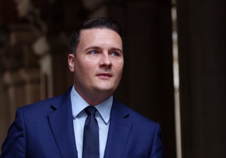 Wes Streeting in a blue suit and tie