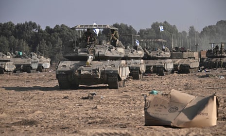 Israeli military armoured vehicles and tanks deployed along the Israel-Gaza border on 24 October