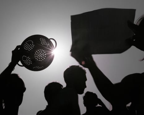 People view the partial solar eclipse at Parliament Hill in London, England.