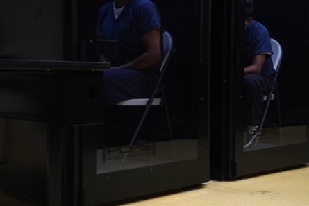 two people sit in row of booths