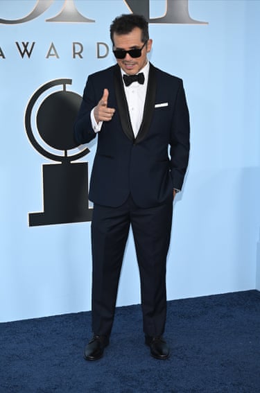 John Leguizamo makes a pistol gesture