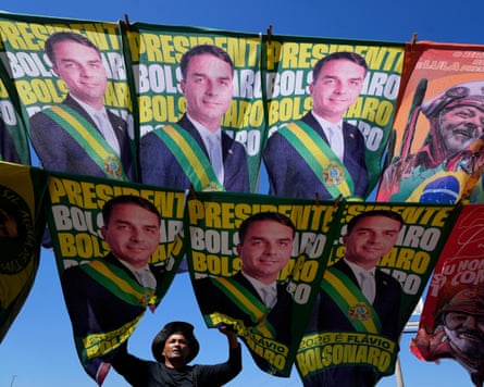 A street vendor sells campaign flags of presidential candidates Sen. Flavio Bolsonaro and current President Luiz Inacio Lula da Silva