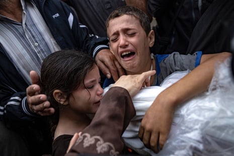 Palestinians mourn their relatives killed in the Israeli bombardment of the Gaza Strip at the hospital in Khan Younis, one of the areas where Israel’s military has insisted Palestinians move to for safety.